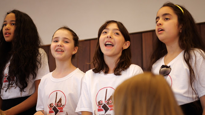 Girls singing in recital